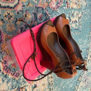 UGG Collection wooden platform sandals.